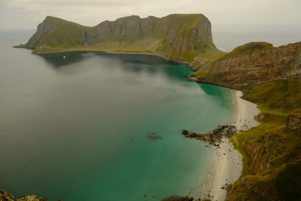 Coastal landscape with a sandy beach and rocky cliffs