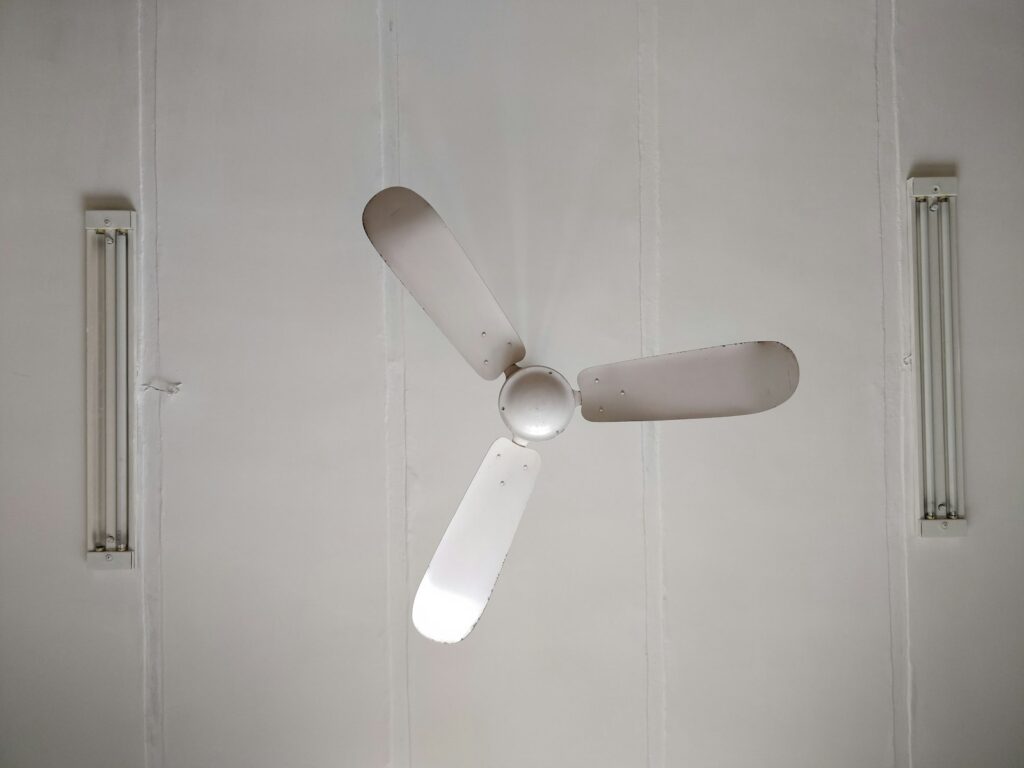 White 3-blade ceiling fan mounted on ceiling