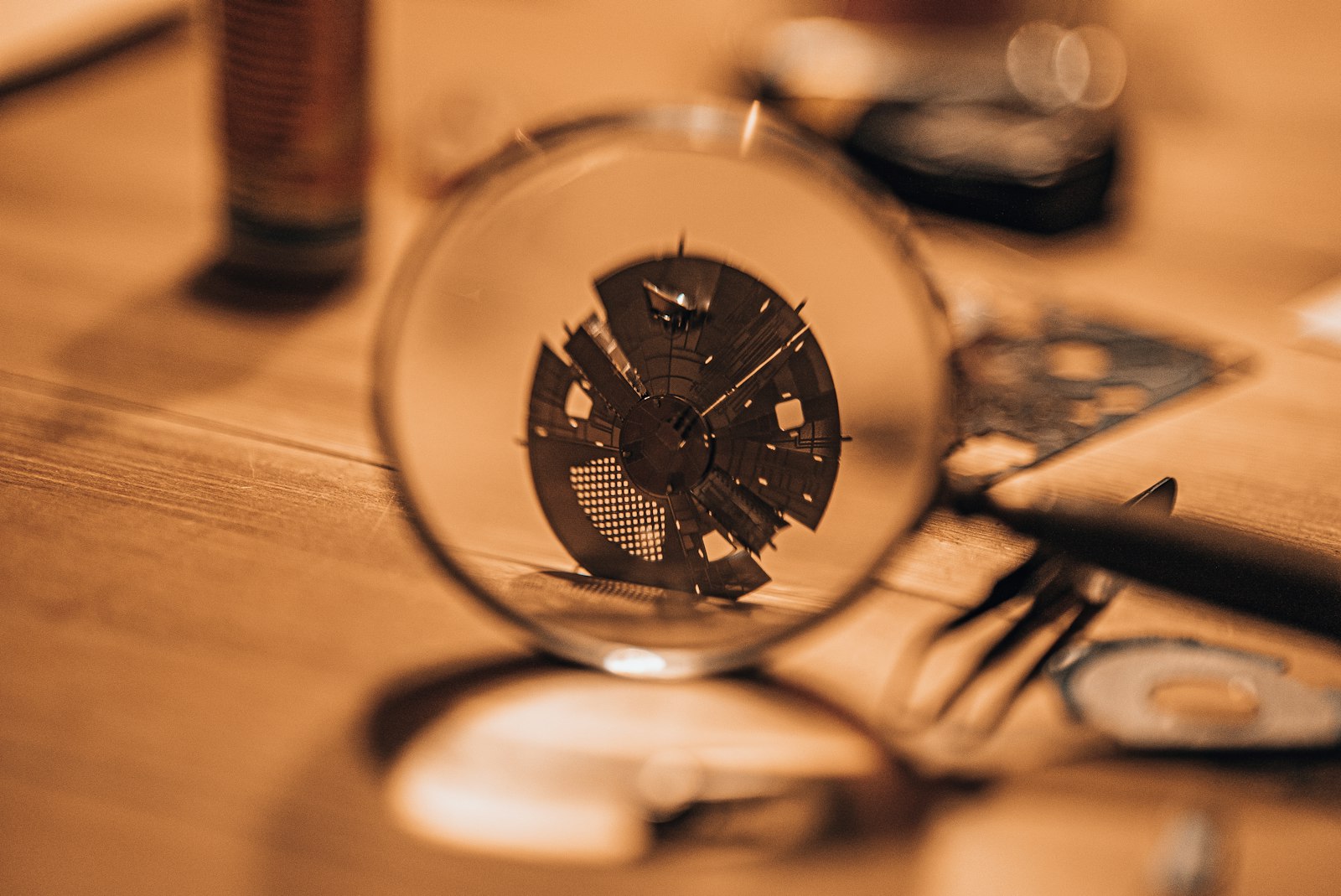 A close up of a magnifying glass on a table