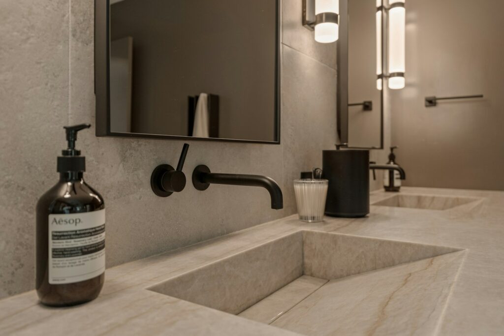 Modern bathroom with double sinks and soap dispenser