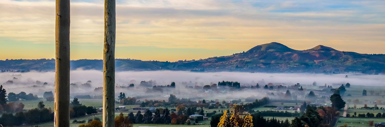 Nature photography of city covered with fogs during golden hour