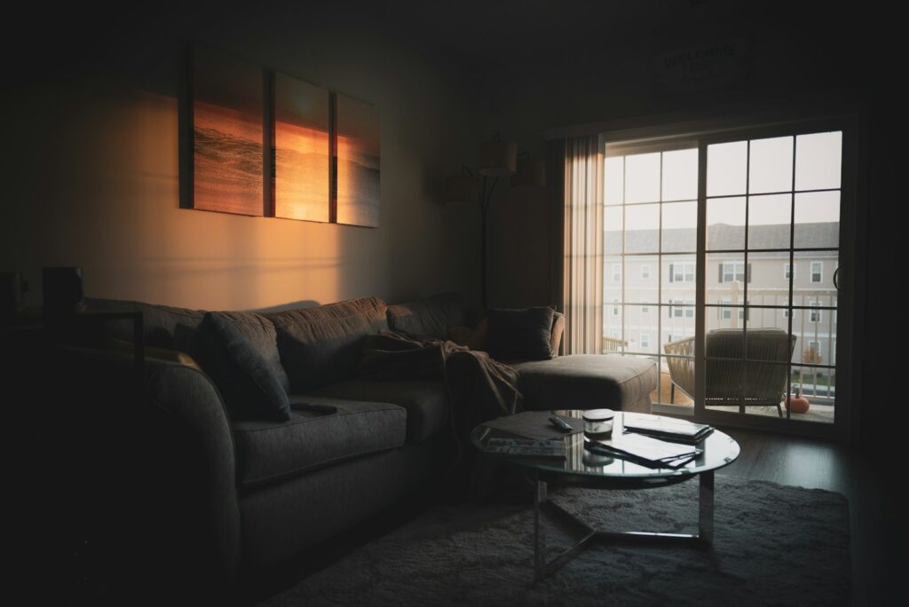 Sectional sofa near coffee table and window