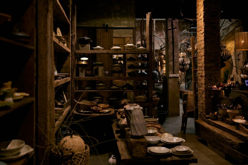 Rustic shop interior with shelves of pottery and goods