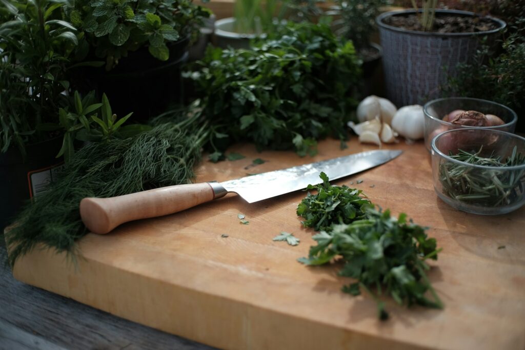 White garlic on brown wooden chopping board