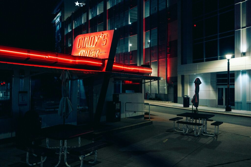 Retro diner with neon sign at night