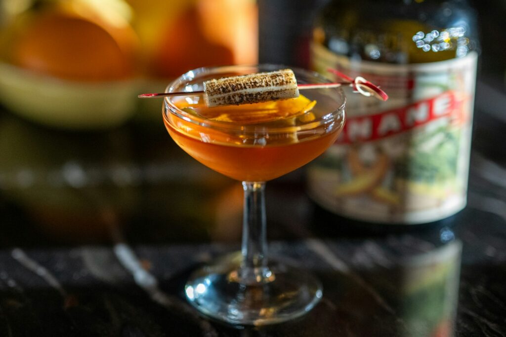 A close up of a drink in a glass on a table