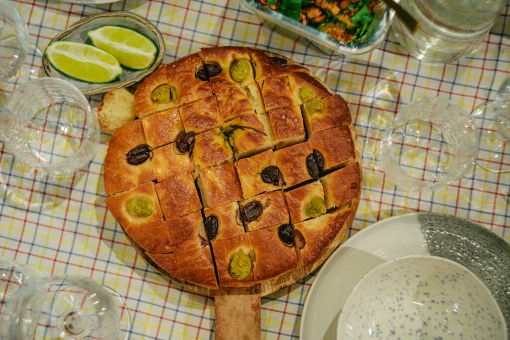 Focaccia bread with olives and lime slices