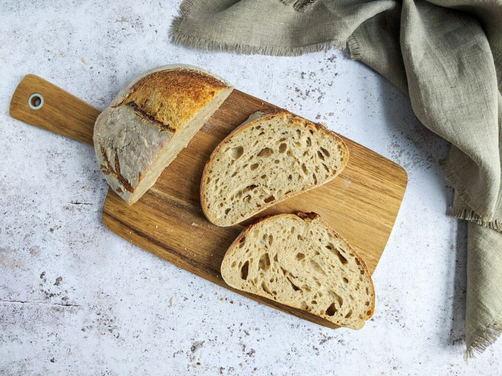 Brown bread on brown wooden chopping board