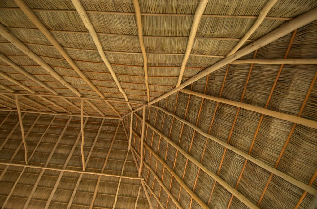 A room with a roof made of bamboo sticks