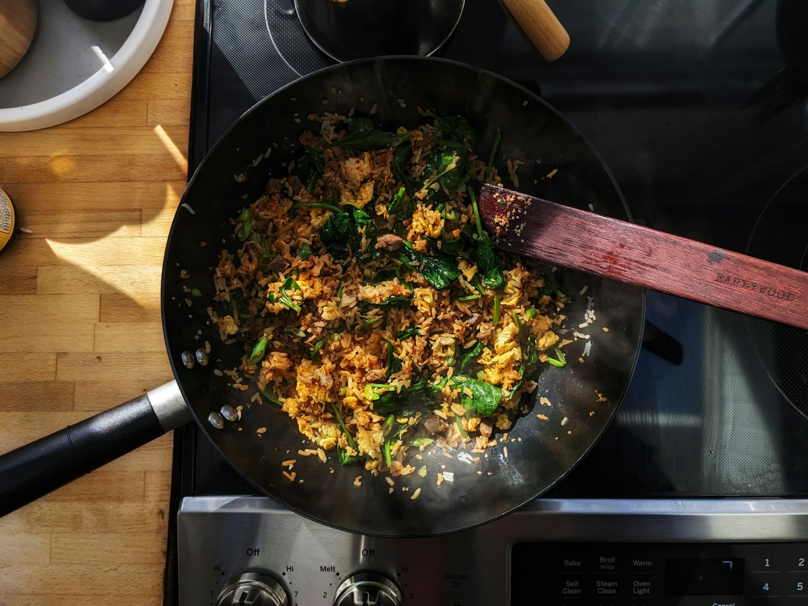 A frying pan filled with food on top of a stove