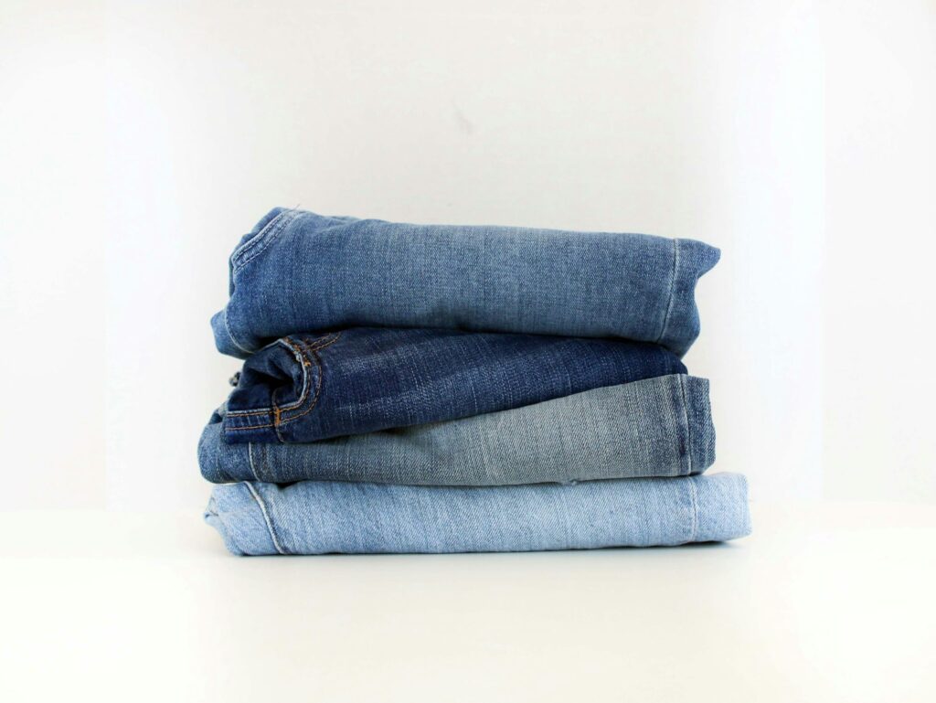 A stack of jeans sitting on top of each other