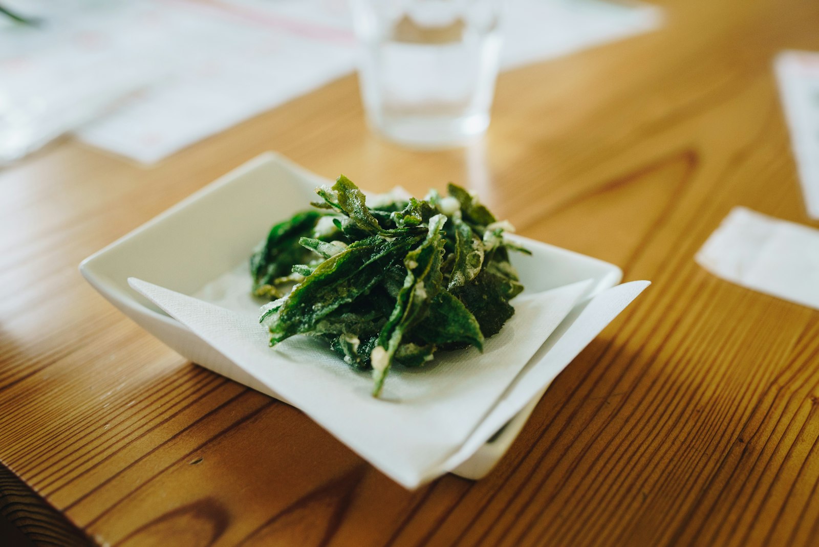 Green vegetable on white ceramic plate