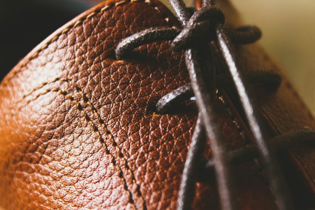 A close up of a brown leather shoe