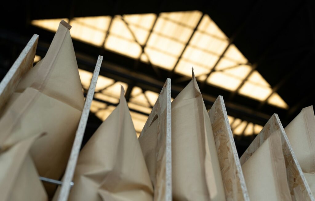 Paper bags are arranged in front of a window