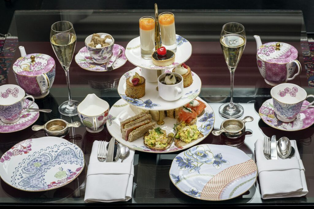 Assorted pastries in rack between plates