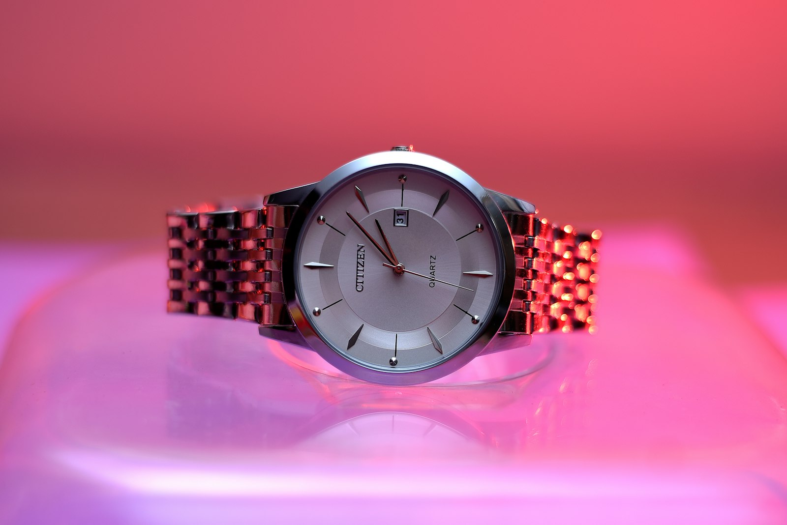 Black and silver round analog watch