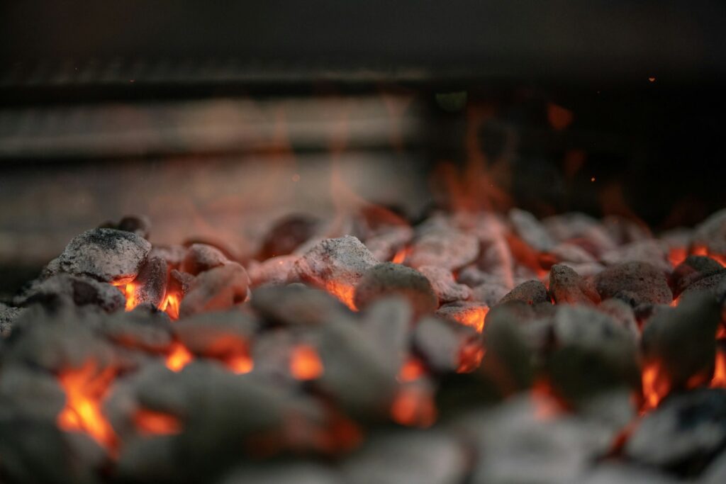 Burning firewood in fire pit