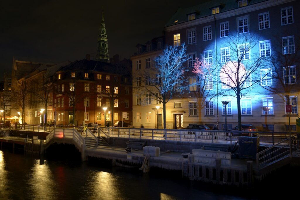 Buildings illuminated by blue lights at night
