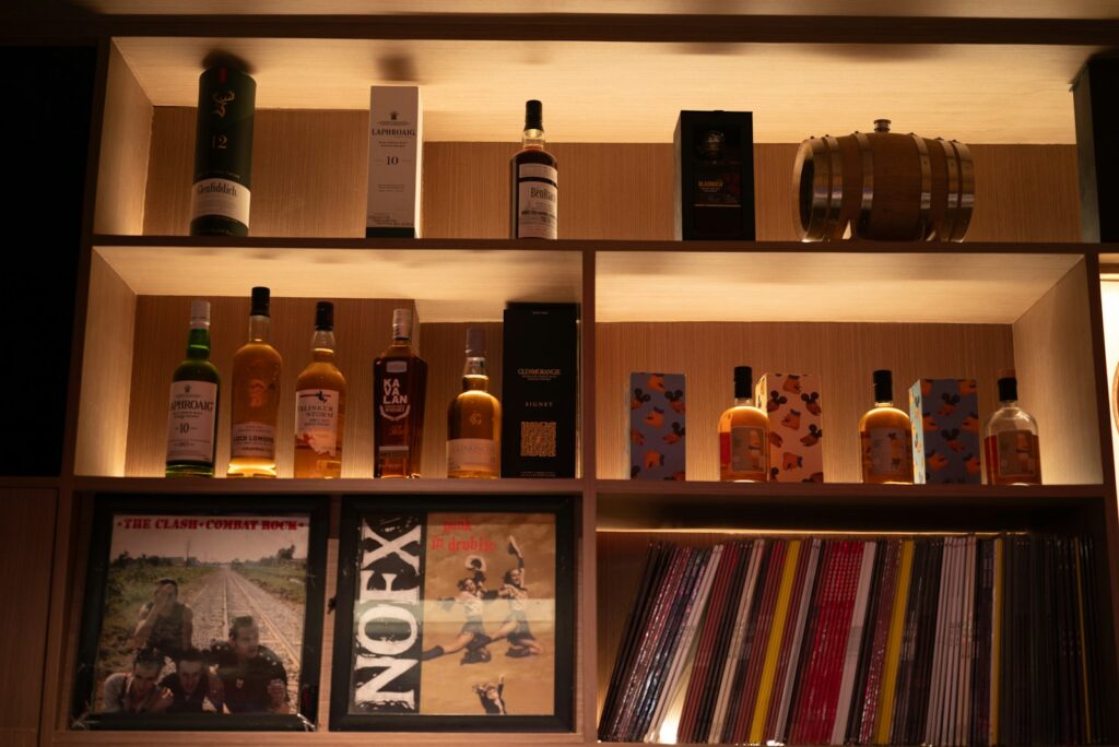 Bottles of liquor and records on shelves