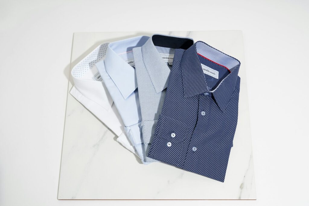 Blue button up shirt on white table