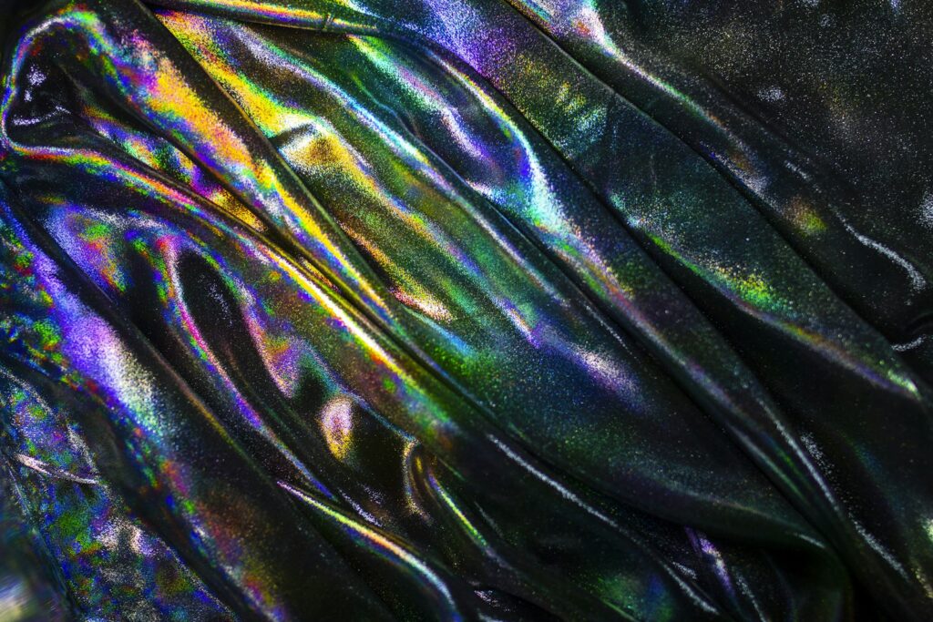 A shiny metallic material with a black background