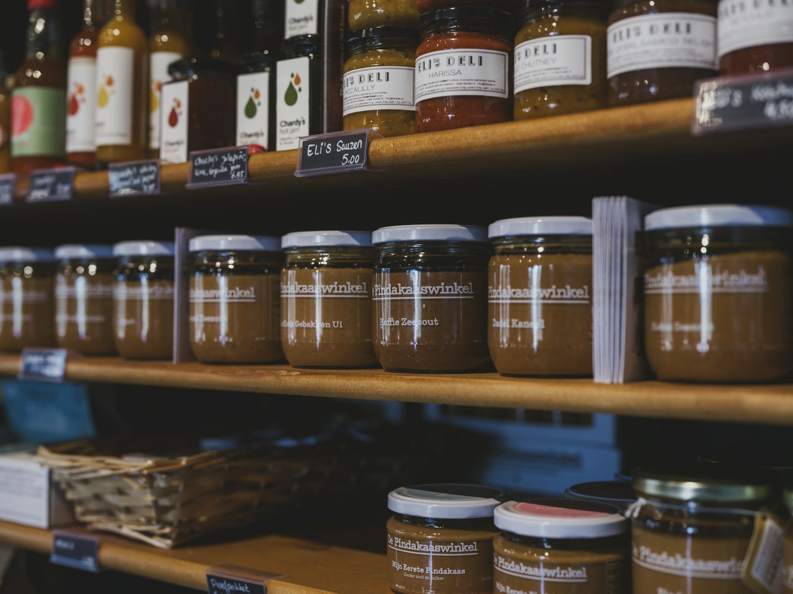Jars of preserves are neatly arranged on shelves