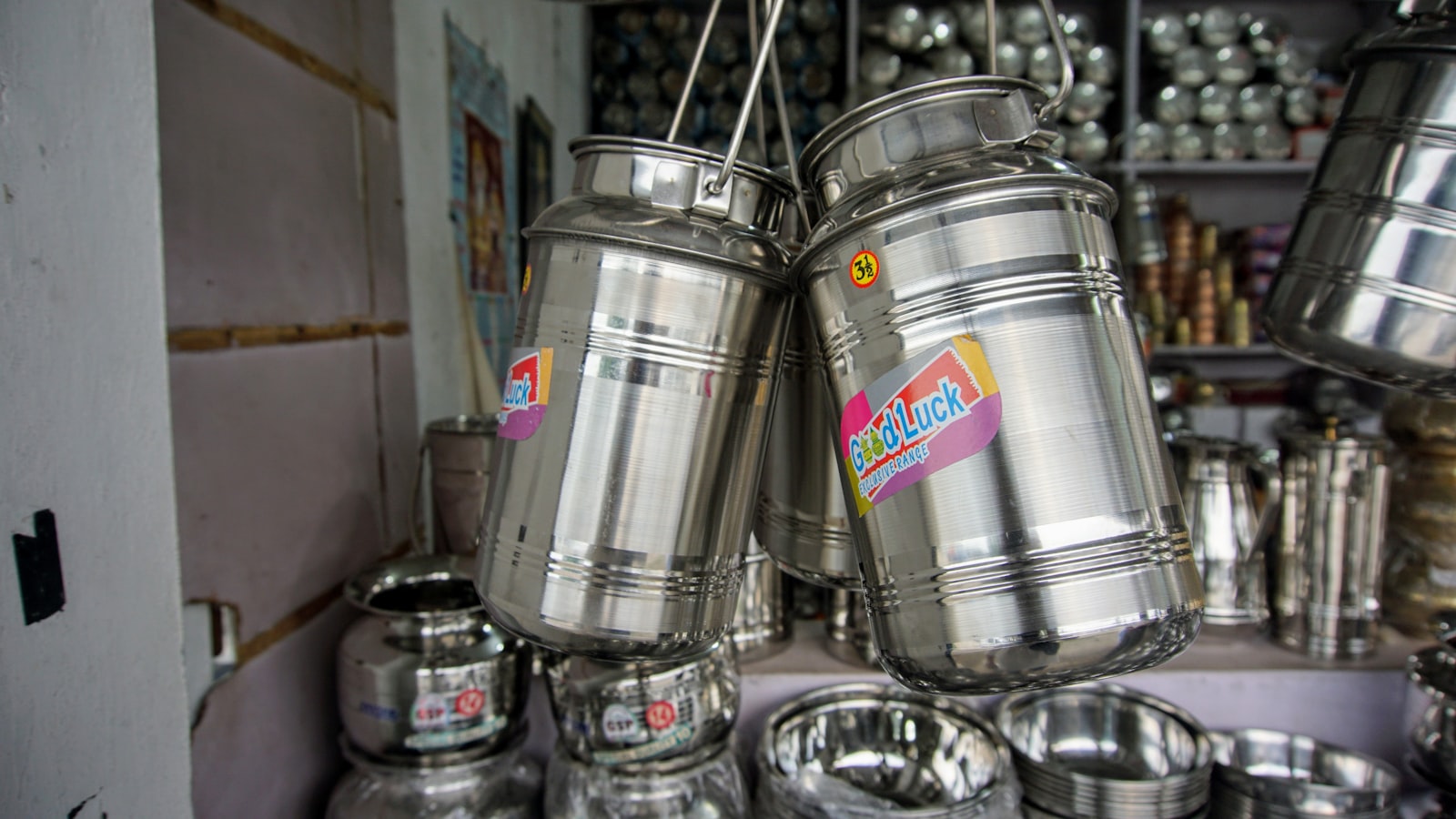 A group of metal containers hanging from a ceiling