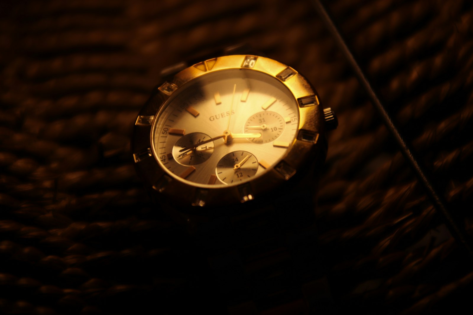 Gold and white round analog watch
