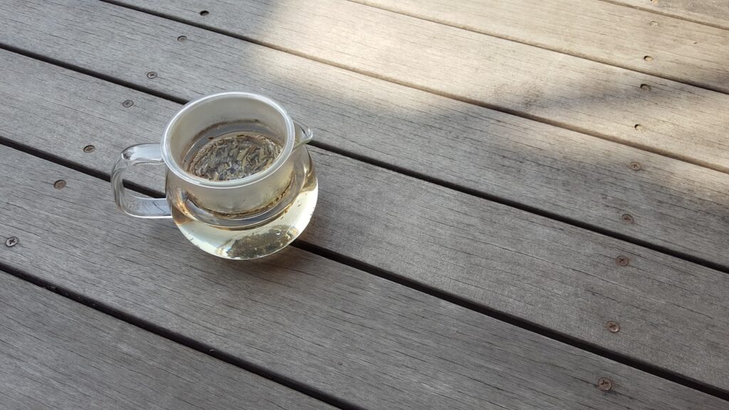 Clear glass mug on brown wooden table
