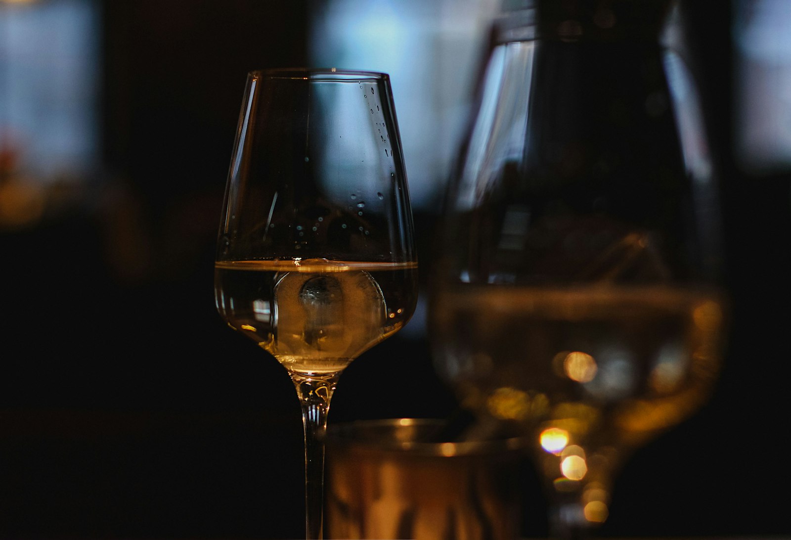 Clear wine glass with brown liquid