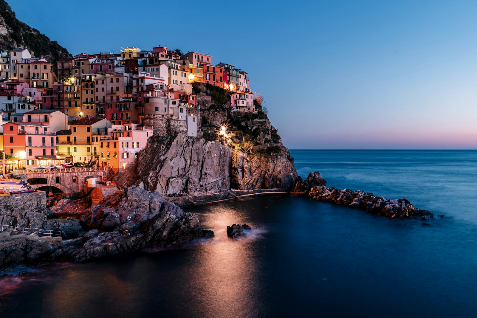 Lighted houses near ocean