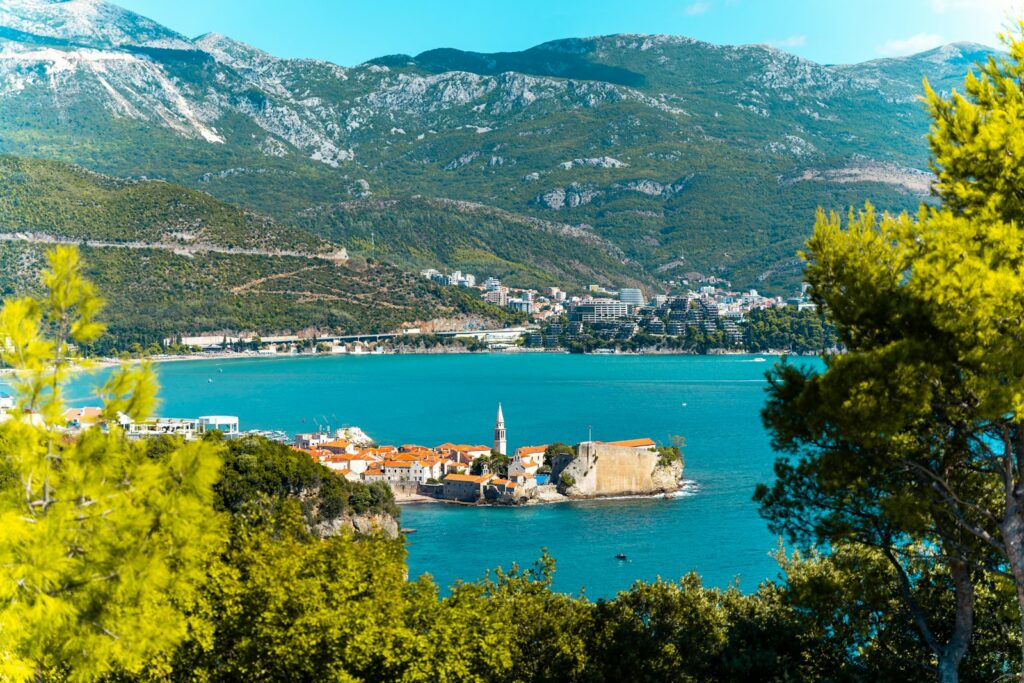 A town on a hill by a lake