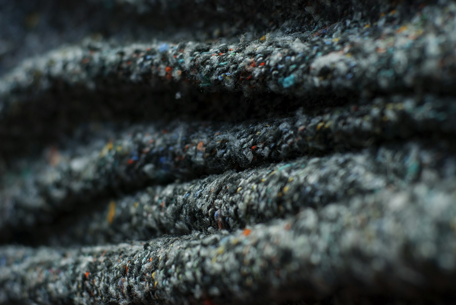 A close up of a black and grey blanket
