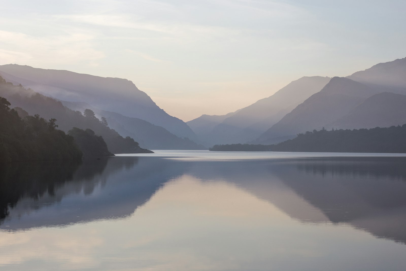 Mountain near body of water during daytime