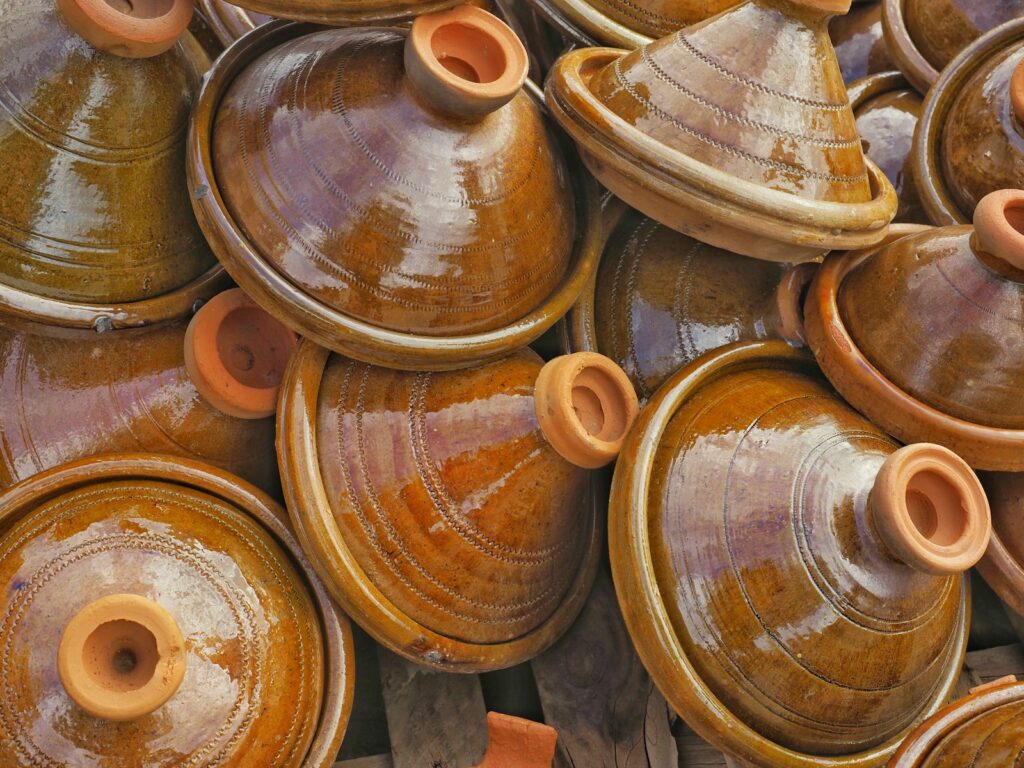 A pile of brown pots sitting next to each other