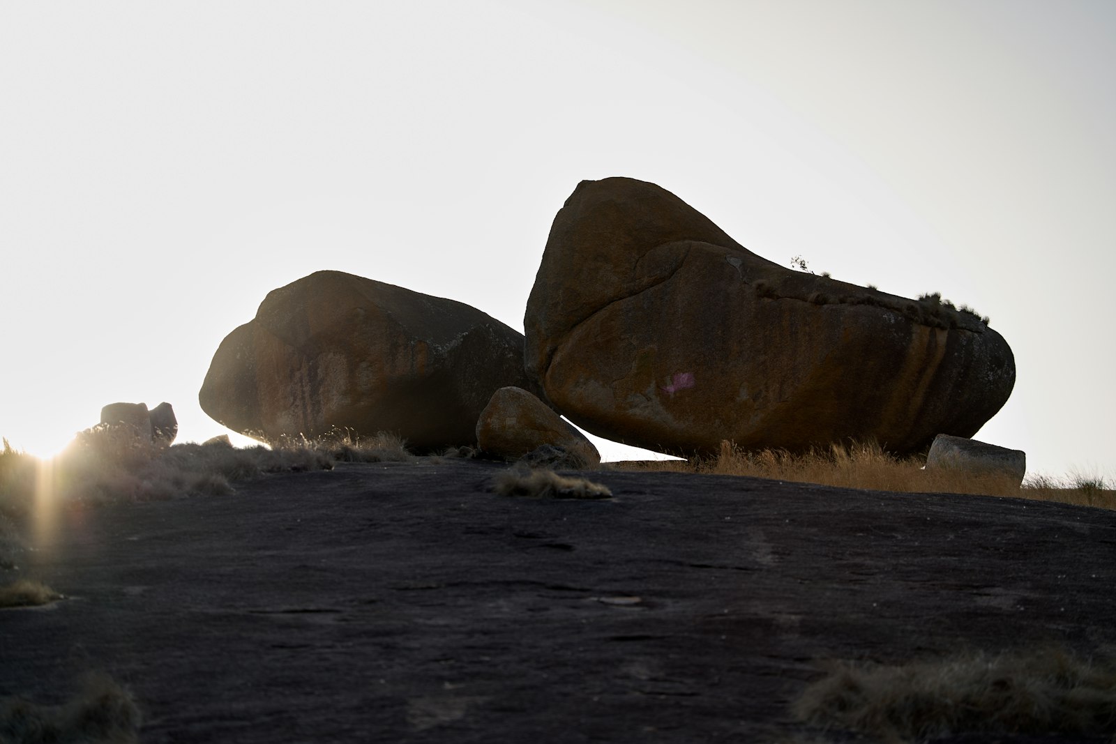 Large boulders on a rocky hilltop at sunset