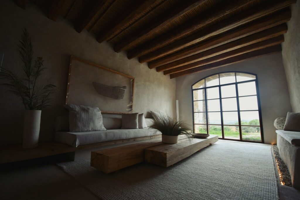 A living room with a couch and a large window