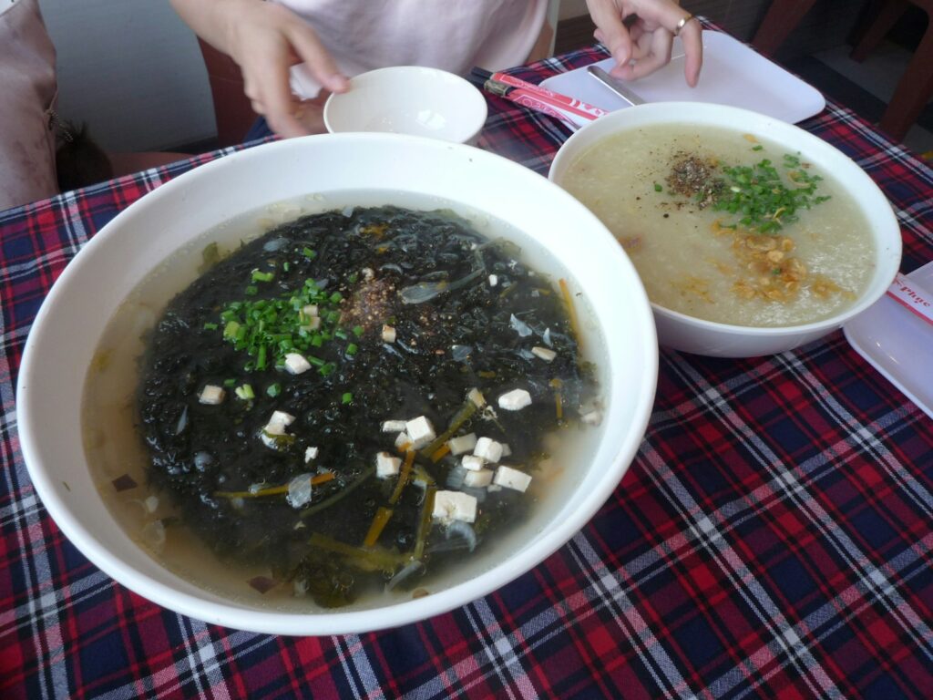 Seaweed soup and porridge served on a plaid tablecloth