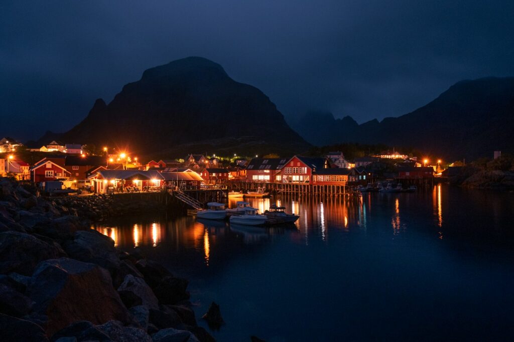 A harbor filled with lots of boats at night