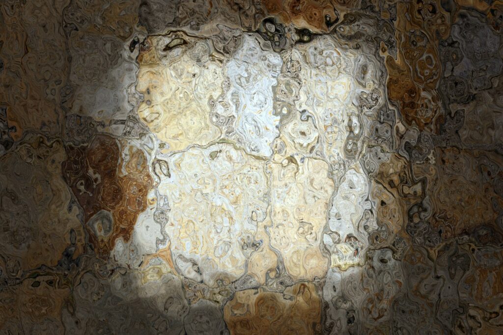 A picture of a wall with a light coming through it
