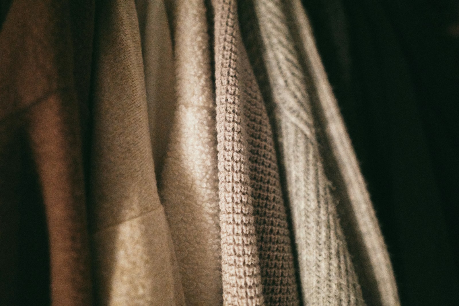 Gray and black textile on black textile