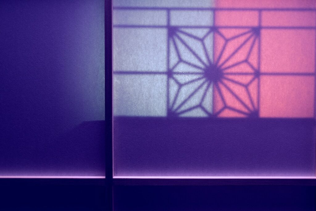 The shadow of a window on a wall