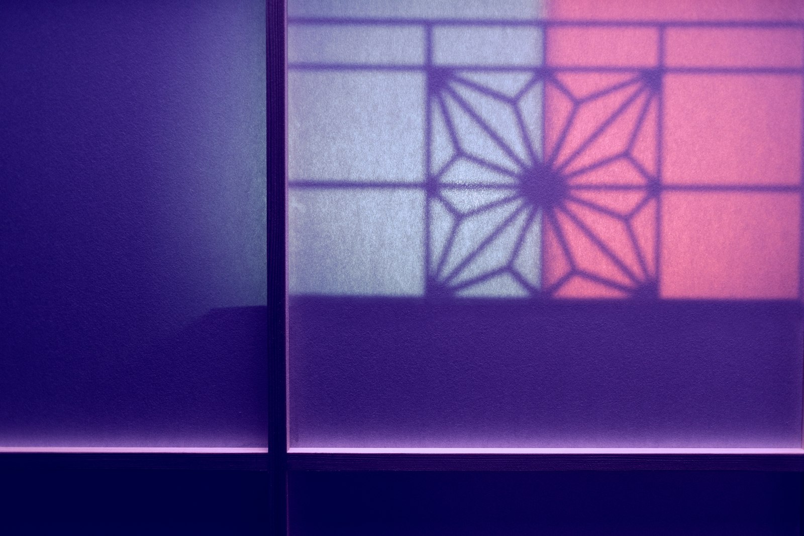 The shadow of a window on a wall