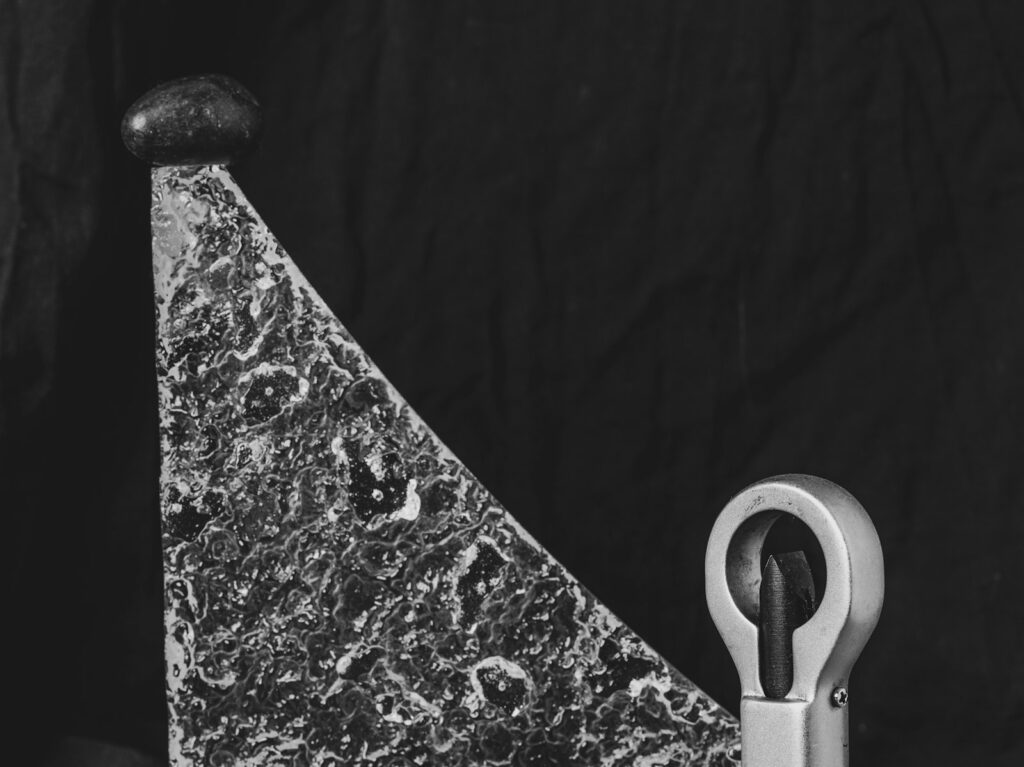 A black and white photo of a pair of scissors