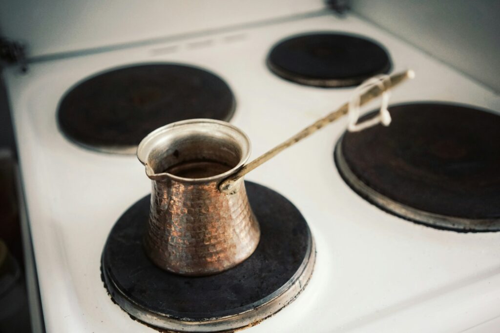 Gray ceramic vase on white stove