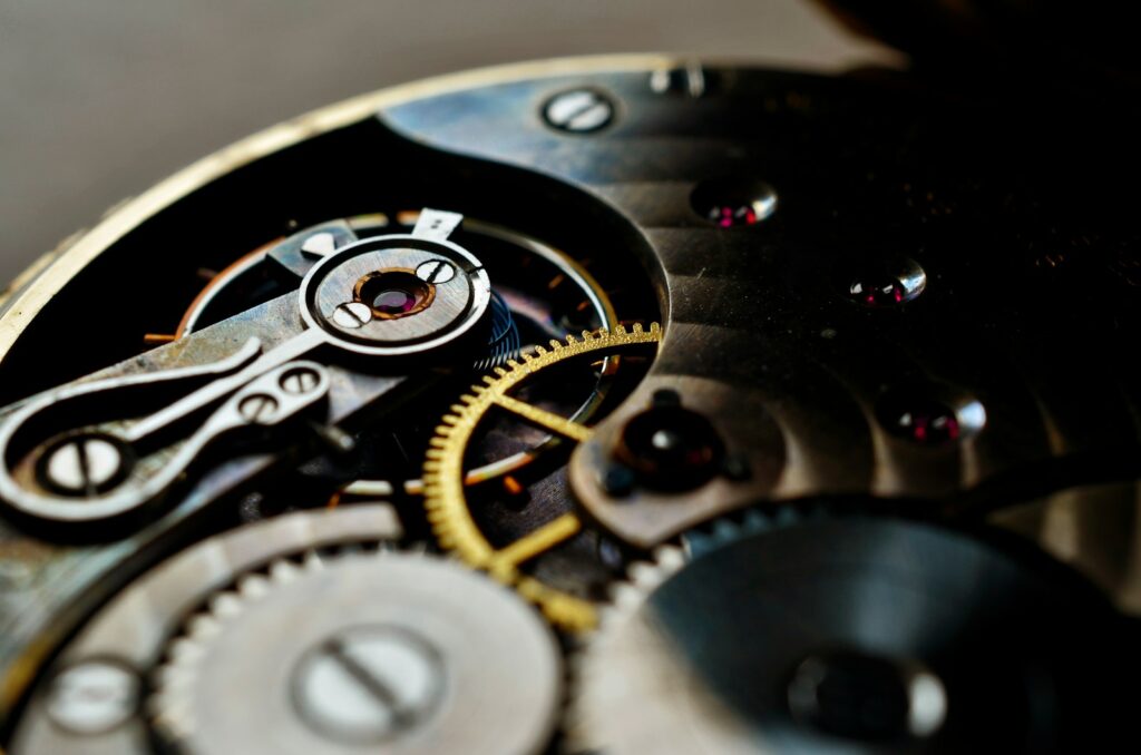 A close up of a watch face with the gears missing