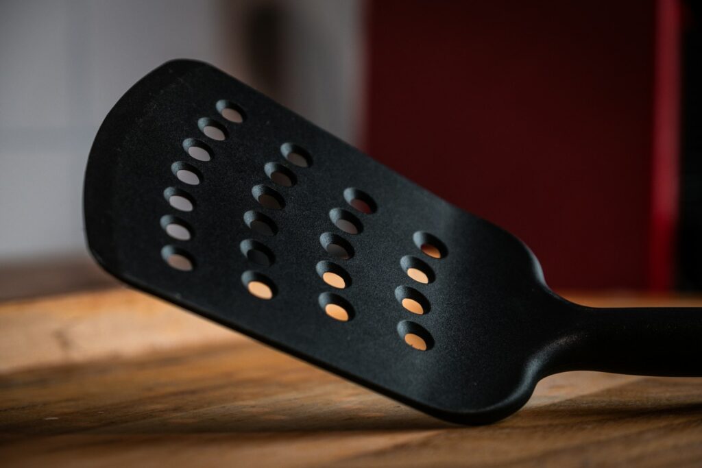 Black plastic chair on brown wooden table