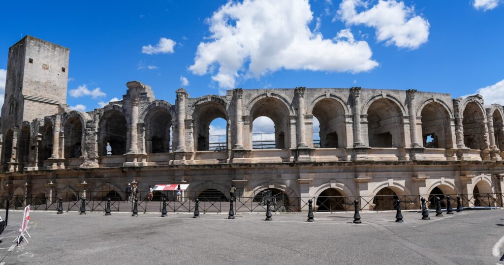 Historic roman amphitheater with arches and tower