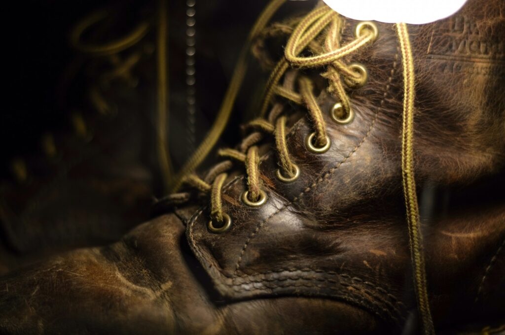 A close up of a pair of brown boots