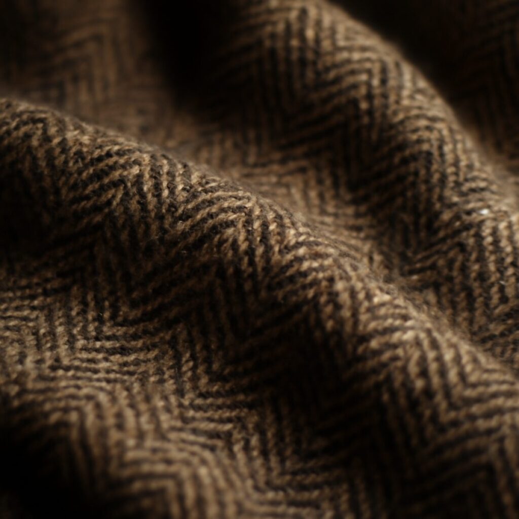 Close-up of thick tweed fabric weave in a country jacket